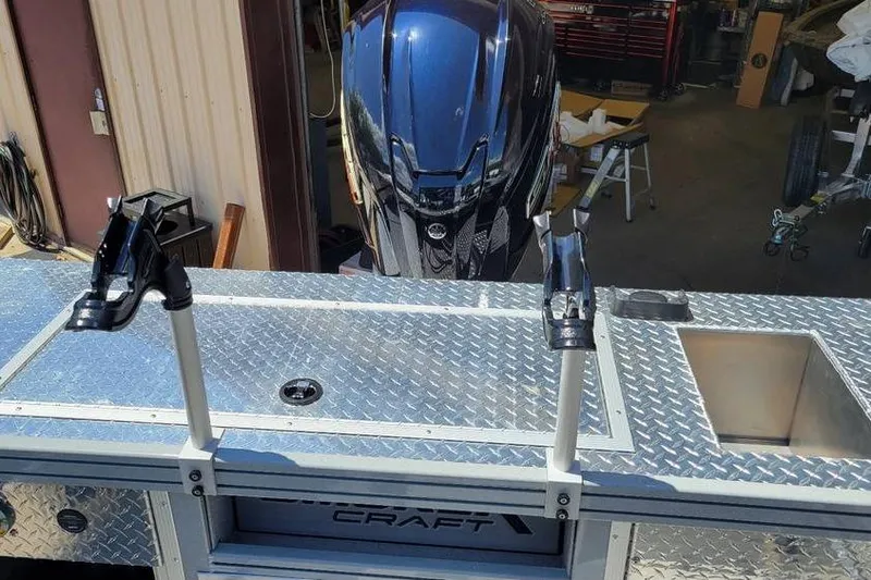 Slide: The Image of 2025 Smoker Craft Phantom 20 X2 OS boat with motor and rod holders. - 25