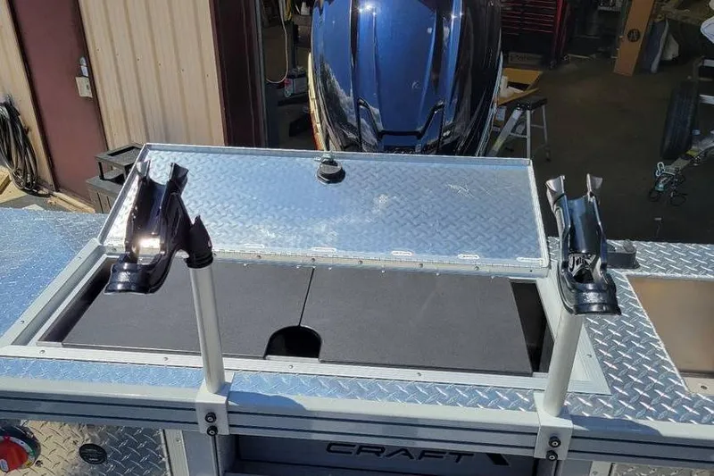 Slide: The Image of 2025 Smoker Craft Phantom 20 X2 OS boat with rod holders and diamond plate deck. - 26