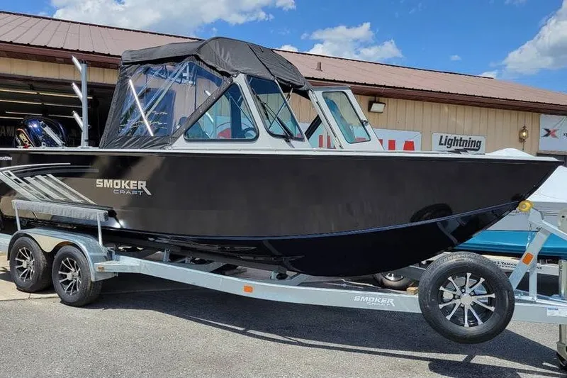 Slide: The Image of 2025 Smoker Craft Phantom 20 X2 OS boat on trailer, parked outdoors. - 3