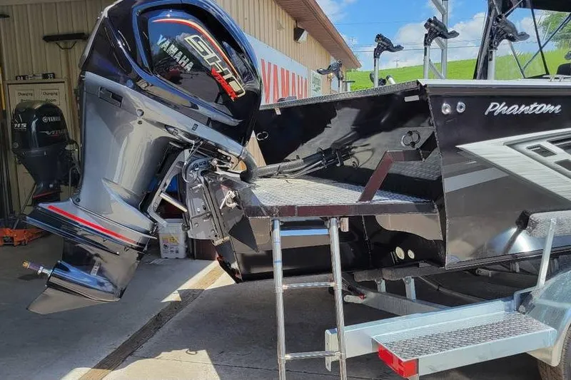 Slide: The Image of 2025 Smoker Craft Phantom 20 X2 OS boat with Yamaha outboard motor in a showroom. - 5