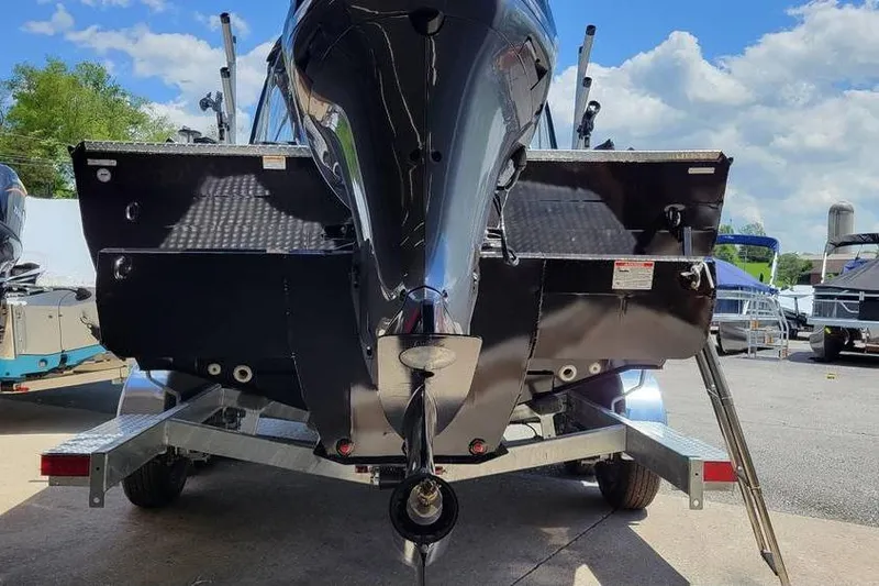 Slide: The Image of 2025 Smoker Craft Phantom 20 X2 OS boat on trailer, rear view under sunny sky. - 6
