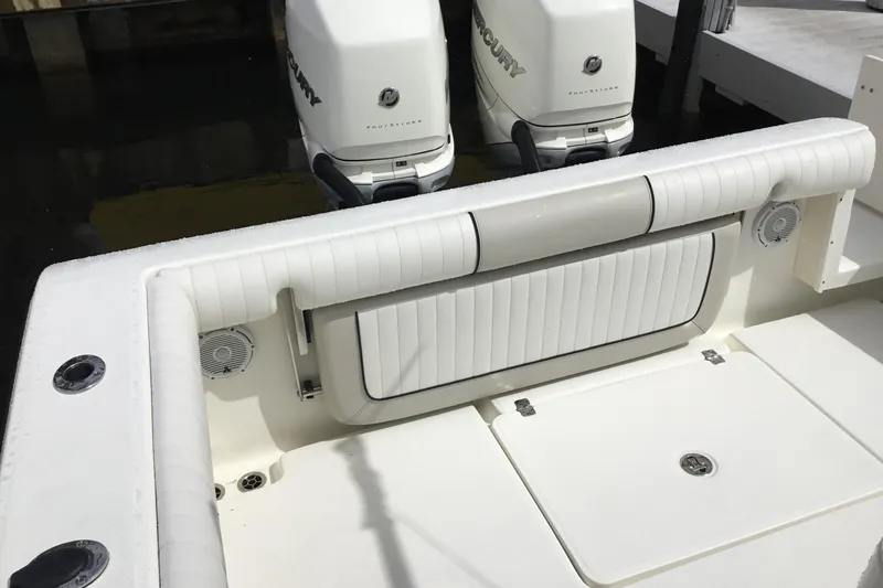 Slide: The Image of 2016 Mako 284 Center Console boat with twin Mercury outboard engines. - 29