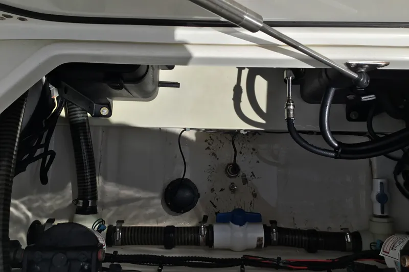 Slide: The Image of 2016 Mako 284 Center Console boat interior showing mechanical components and wiring. - 34