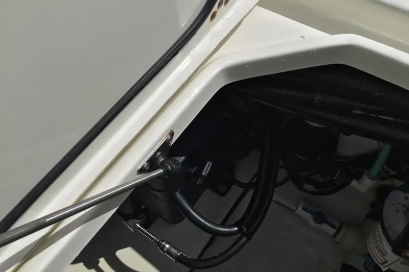 Slide: The Image of 2016 Mako 284 Center Console boat interior with visible wiring and components. - 36