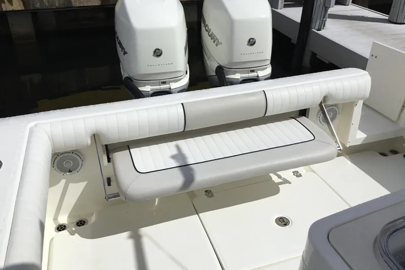 Slide: The Image of 2016 Mako 284 Center Console boat with dual Mercury engines and cushioned seating. - 39