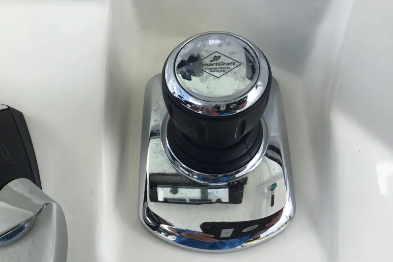 Slide: The Image of SmartCraft control knob on 2016 Mako 284 Center Console boat dashboard. - 52
