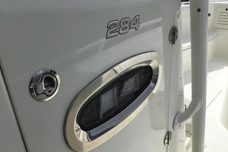 Slide: The Image of 2016 Mako 284 Center Console boat detail with chrome accents. - 56