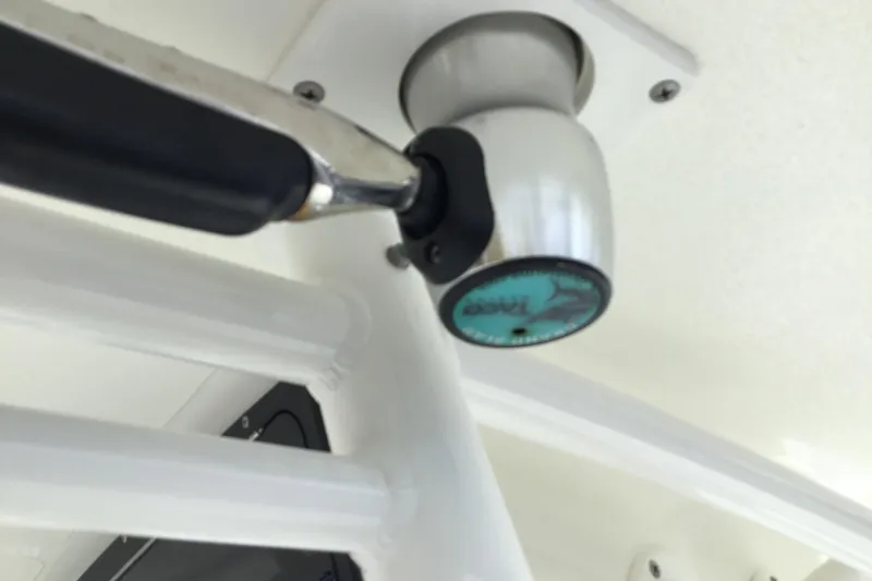 Slide: The Image of 2016 Mako 284 Center Console boat detail with logo on handle. - 58