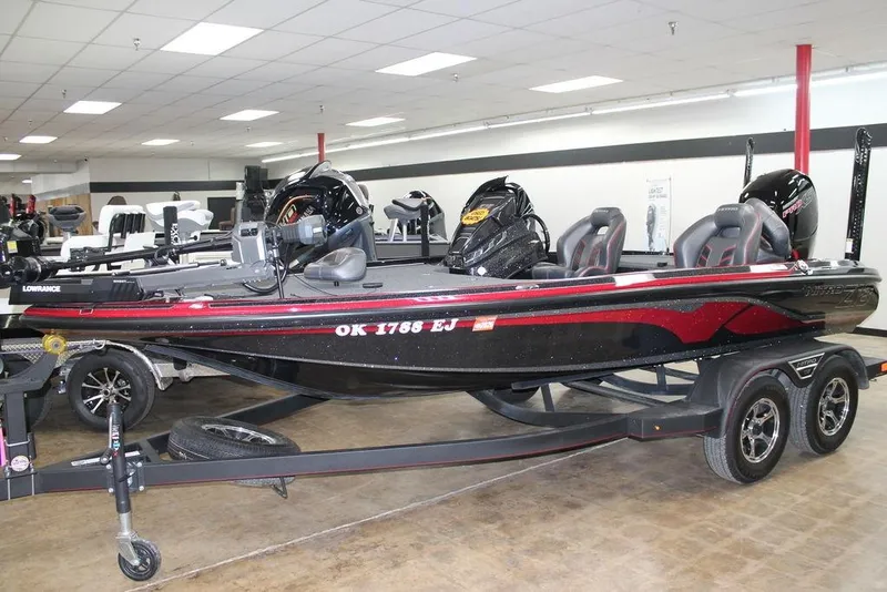 Slide: The Image of 2022 Nitro Z18 Pro bass boat on trailer in showroom. - 0