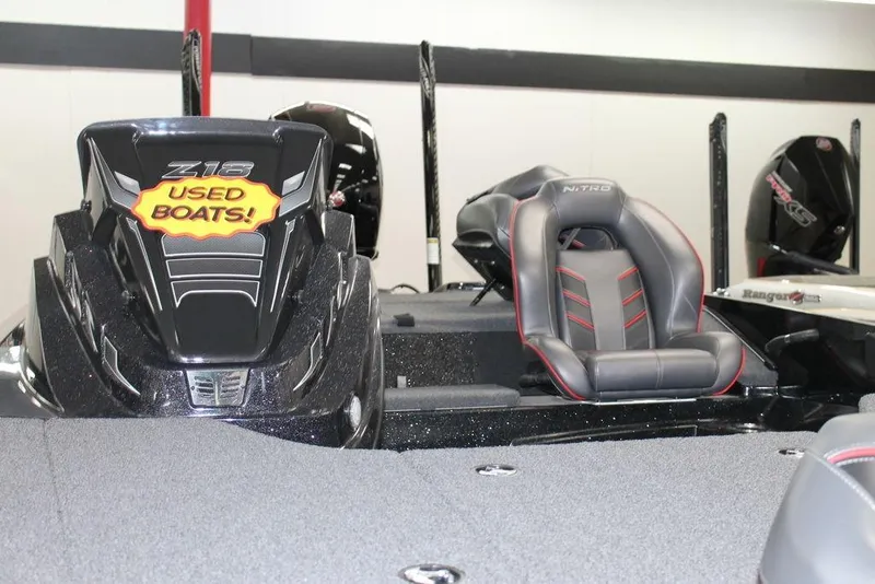 Slide: The Image of 2022 Nitro Z18 Pro boat interior with "Used Boats" sticker, featuring sleek seating. - 9