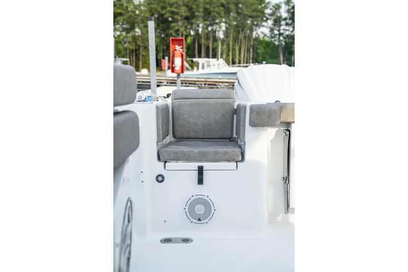 Slide: The Image of 2026 Sea Hunt Gamefish 28 Forward Seating with gray cushioned seat and speaker. - 12