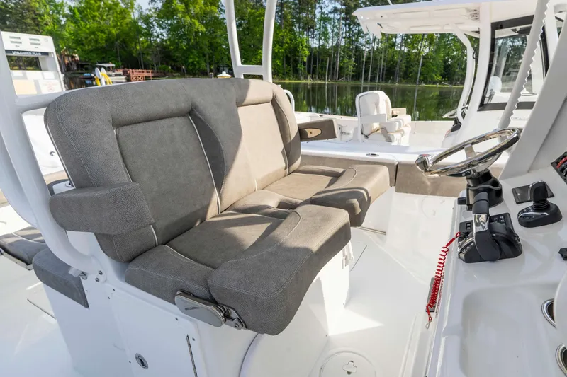 Slide: The Image of 2026 Sea Hunt Gamefish 28 boat interior with forward seating and steering console. - 16