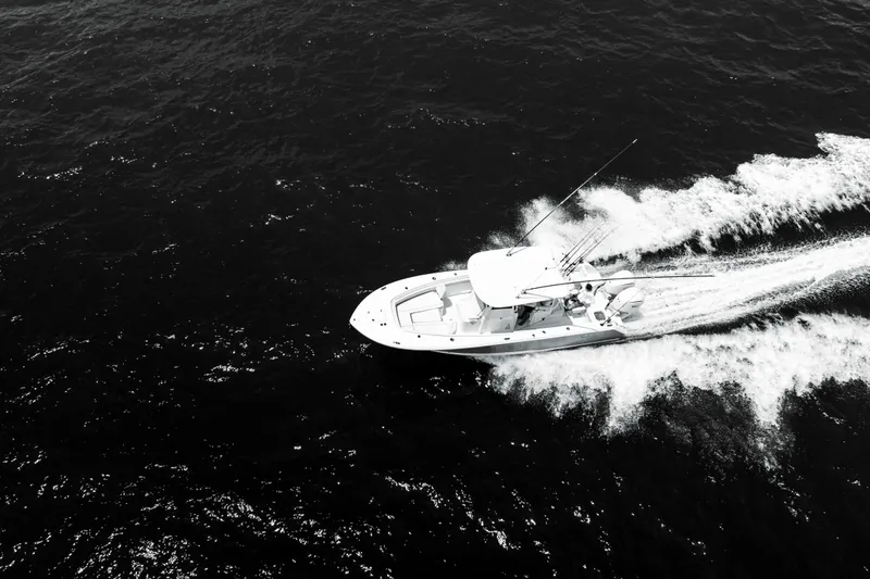 Slide: The Image of Aerial view of 2026 Sea Hunt Gamefish 28 boat speeding on open water. - 21