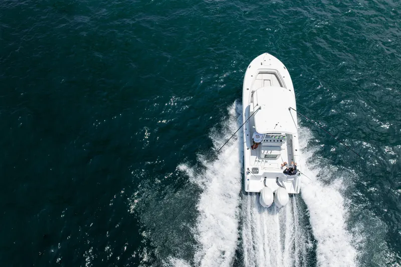 Slide: The Image of 2026 Sea Hunt Gamefish 28 cruising on open water, aerial view. - 25