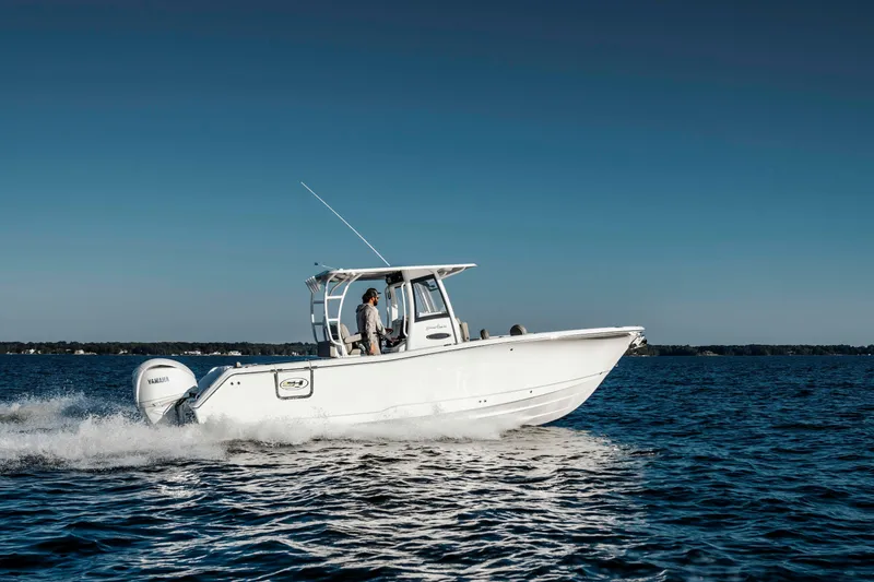 Slide: The Image of 2026 Sea Hunt Gamefish 28 Forward Seating boat cruising on open water. - 4