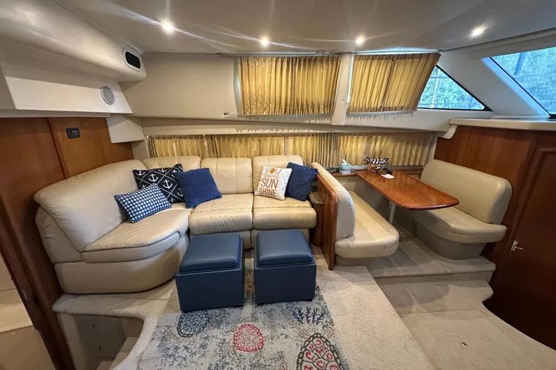 Slide: The Image of Luxurious interior of 2005 Carver 41 Cockpit Motor Yacht with plush seating and elegant decor. - 6
