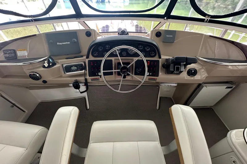 Slide: The Image of 2005 Carver 41 Cockpit Motor Yacht helm with Raymarine navigation system. - 14