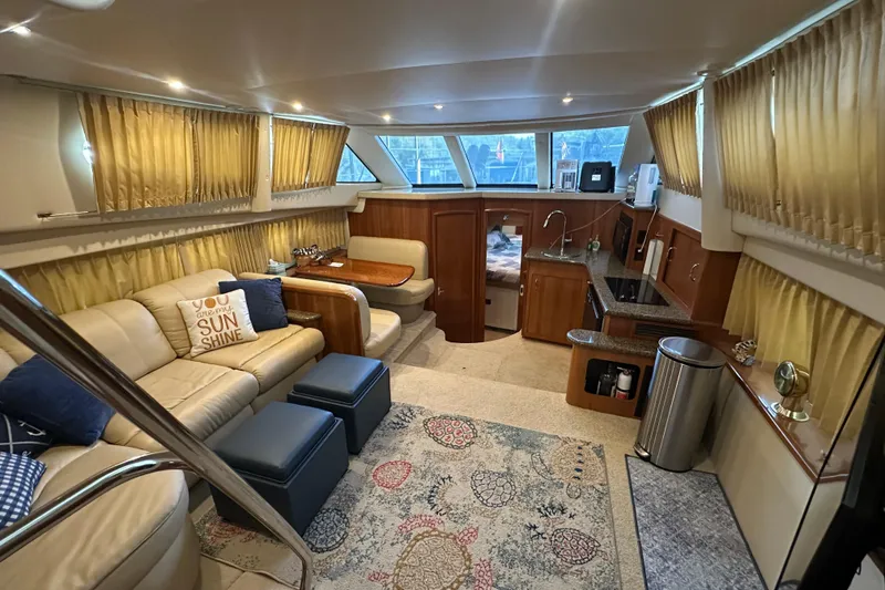 Slide: The Image of Luxurious interior of 2005 Carver 41 Cockpit Motor Yacht with elegant seating and decor. - 5