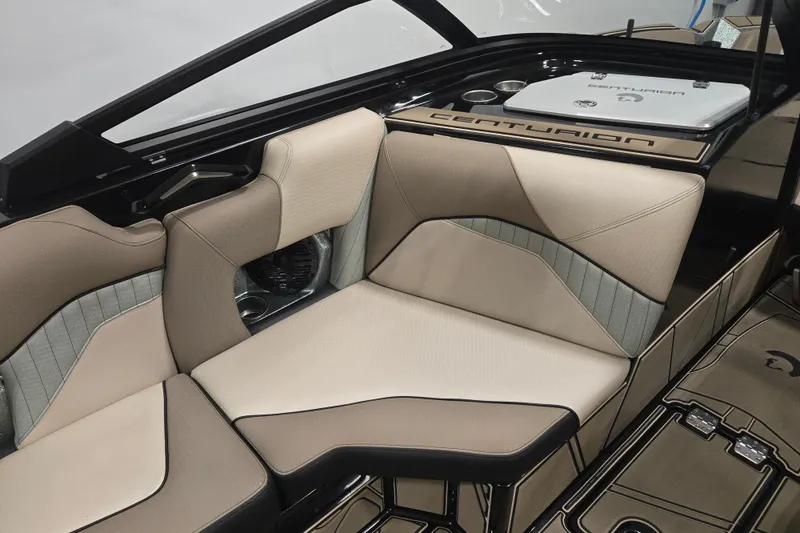 Slide: The Image of 2023 Centurion Fi23 boat interior with beige and gray seating, showcasing luxury design. - 6