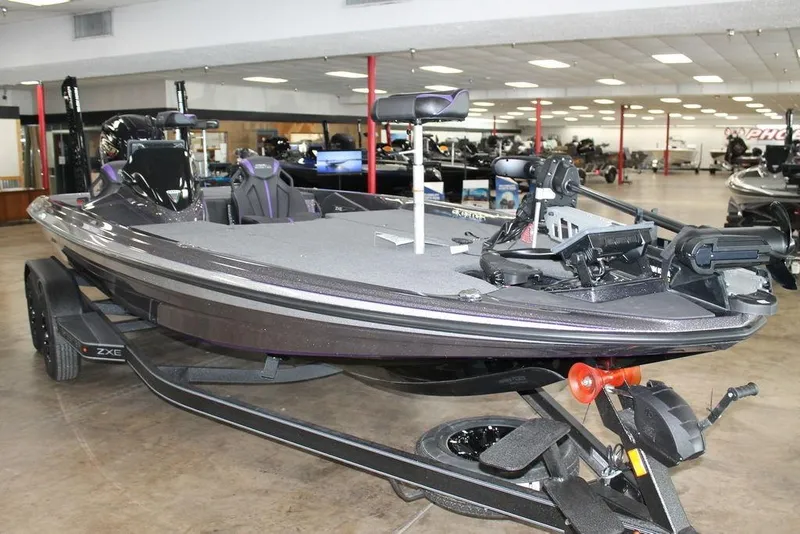 Slide: The Image of 2026 Skeeter ZXE21 bass boat displayed in showroom, featuring advanced fishing equipment. - 2