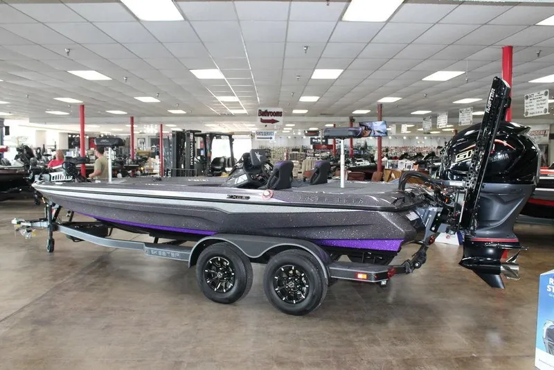 Slide: The Image of 2026 Skeeter ZXE21 boat displayed in showroom, featuring sleek design and modern technology. - 3