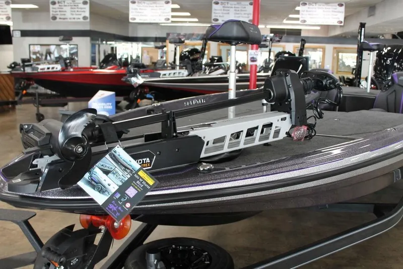 Slide: The Image of 2026 Skeeter ZXE21 boat with Minn Kota Ultrex trolling motor in showroom. - 4