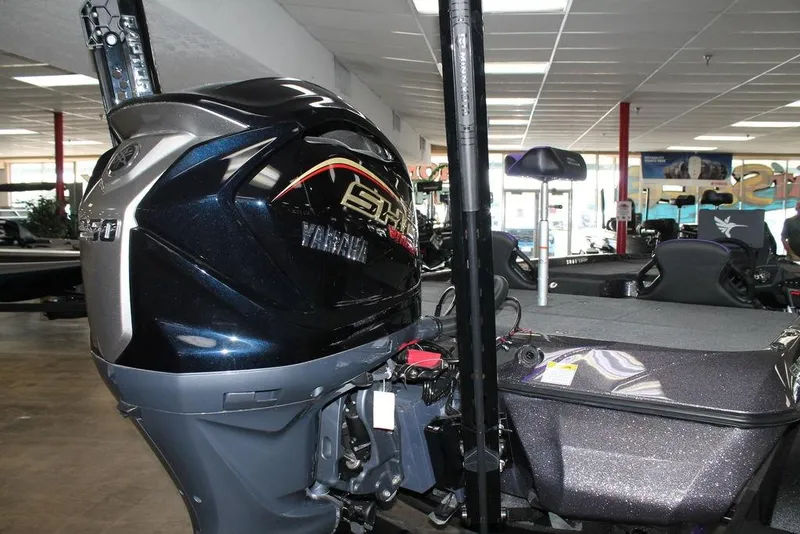 Slide: The Image of 2026 Skeeter ZXE21 boat with Yamaha engine in showroom setting. - 5