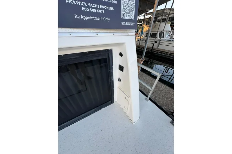 Slide: The Image of 1996 Gibson 50 Cabin Yacht at dock, featuring side view and broker contact details. - 12