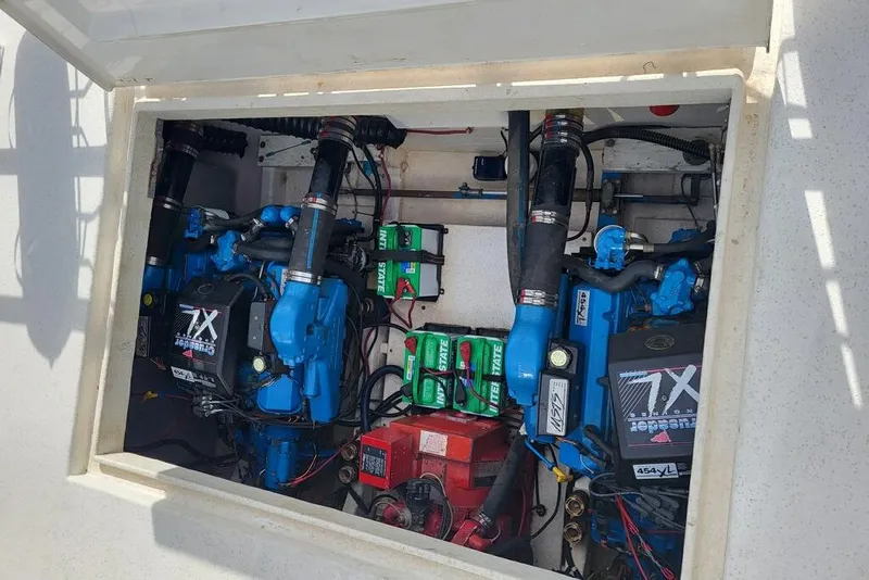 Slide: The Image of Engine compartment of a 1996 Gibson 50 Cabin Yacht with visible components and wiring. - 13