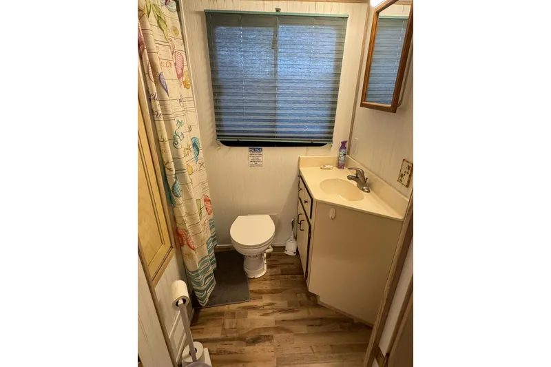 Slide: The Image of Bathroom interior of 1996 Gibson 50 Cabin Yacht with shower, toilet, and sink. - 22