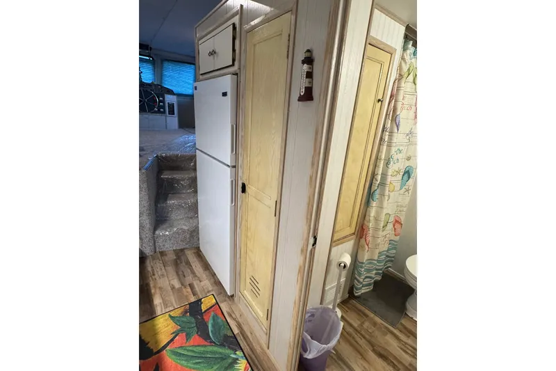 Slide: The Image of Interior of 1996 Gibson 50 Cabin Yacht with kitchen and bathroom view. - 27