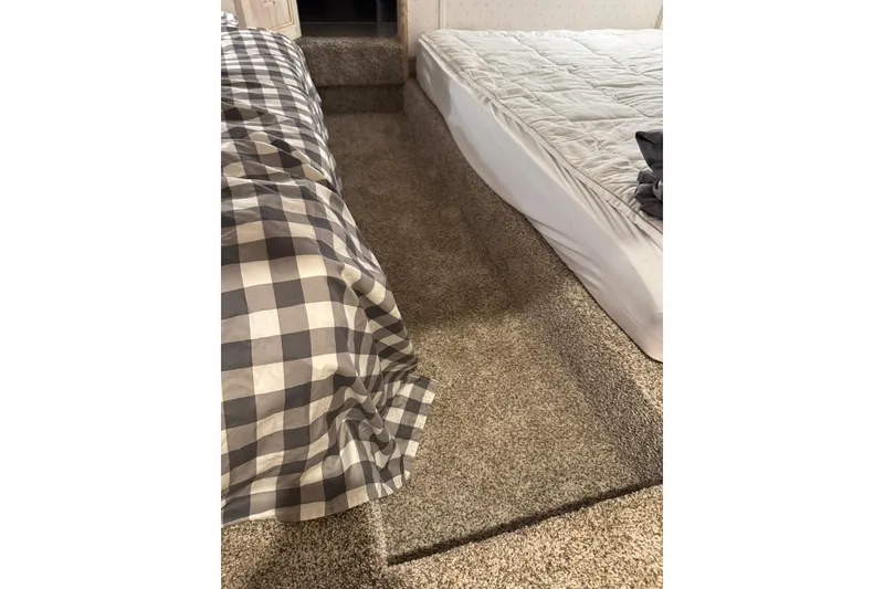 Slide: The Image of Interior of 1996 Gibson 50 Cabin Yacht with carpeted floor and two beds. - 33