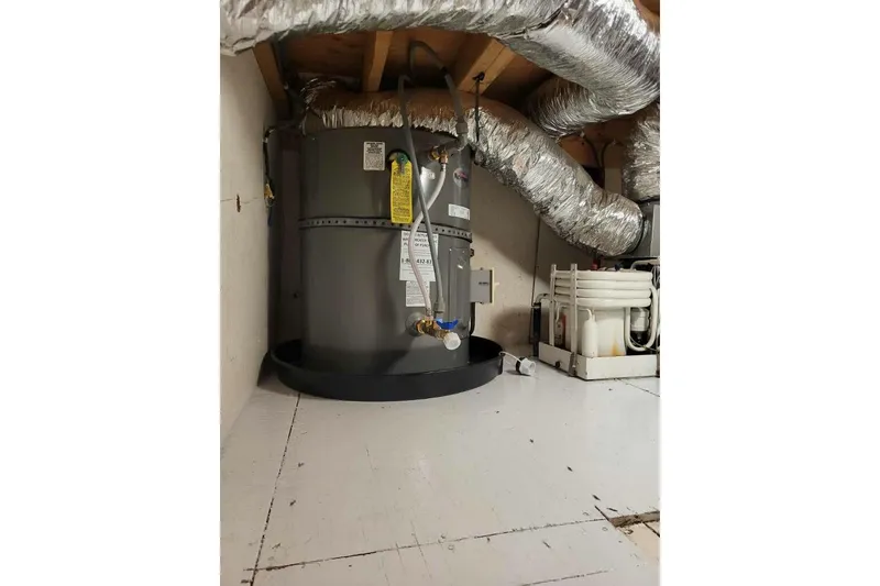Slide: The Image of Water heater and ductwork in 1996 Gibson 50 Cabin Yacht interior. - 39