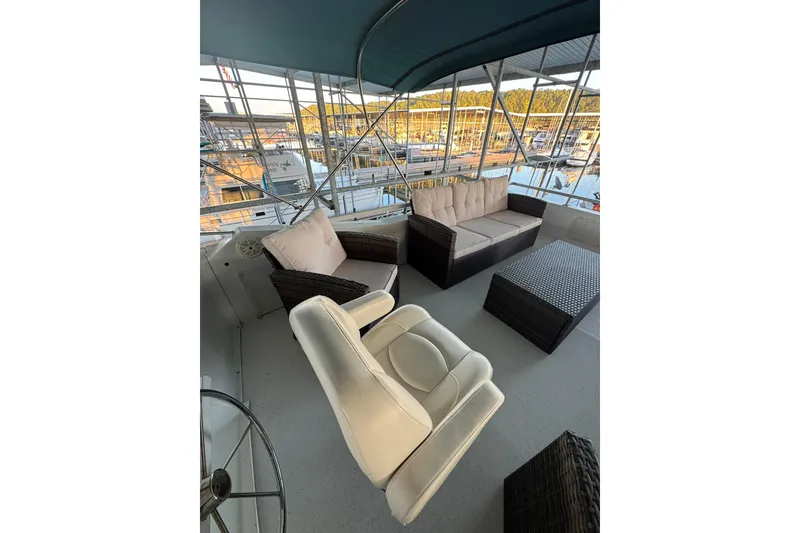 Slide: The Image of Luxurious seating area on a 1996 Gibson 50 Cabin Yacht with marina view. - 7