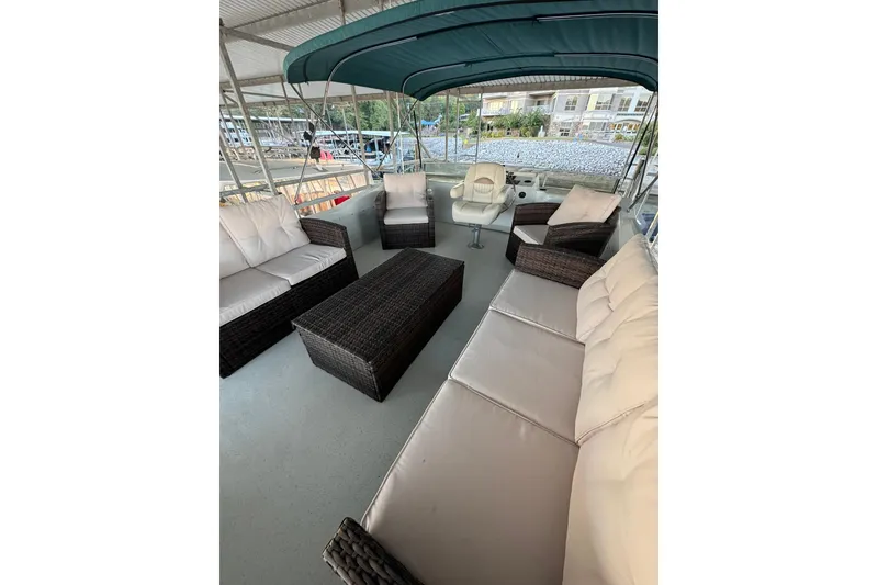 Slide: The Image of Spacious deck of 1996 Gibson 50 Cabin Yacht with comfortable seating and canopy. - 8