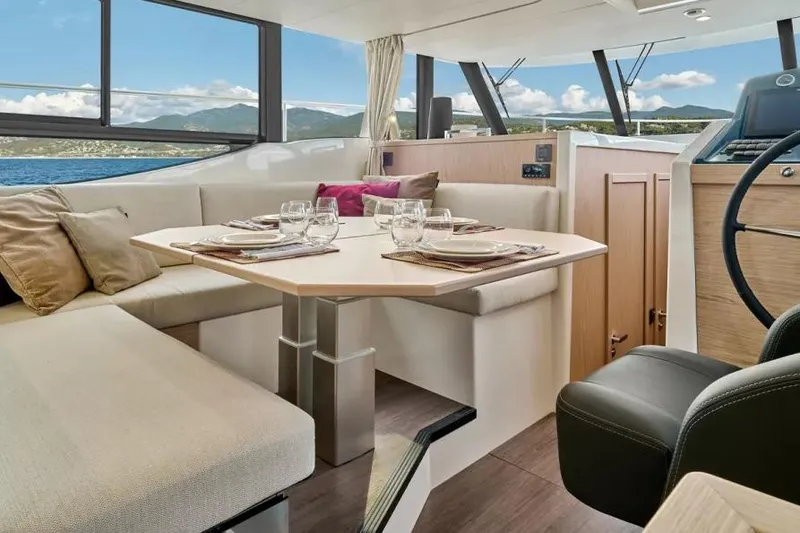 Slide: The Image of Interior of 2026 Beneteau Swift Trawler 48 with elegant dining area and scenic views. - 7
