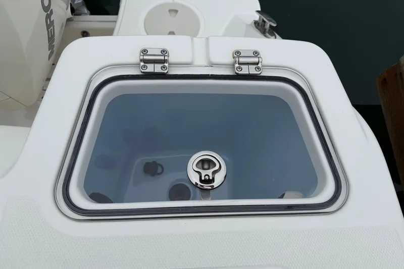 Slide: The Image of 2024 Boston Whaler 250 Outrage docked at marina under cloudy skies. - 17