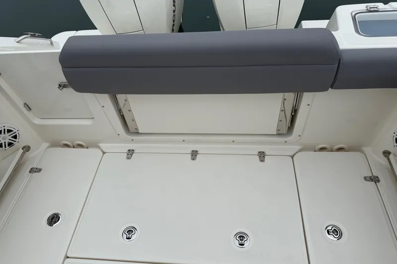 Slide: The Image of 2024 Boston Whaler 250 Outrage docked at marina, front view. - 18