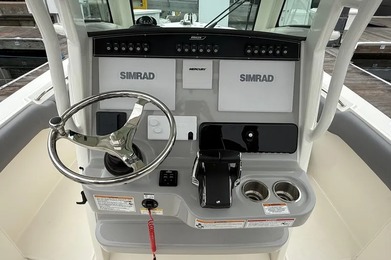 Slide: The Image of 2024 Boston Whaler 250 Outrage boat compartment with wiring and components. - 30