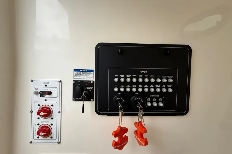 Slide: The Image of 2024 Boston Whaler 250 Outrage boat water connections and safety warnings. - 36