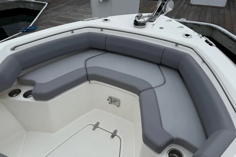 Slide: The Image of 2024 Boston Whaler 250 Outrage boat seats, featuring sleek gray upholstery and modern design. - 39