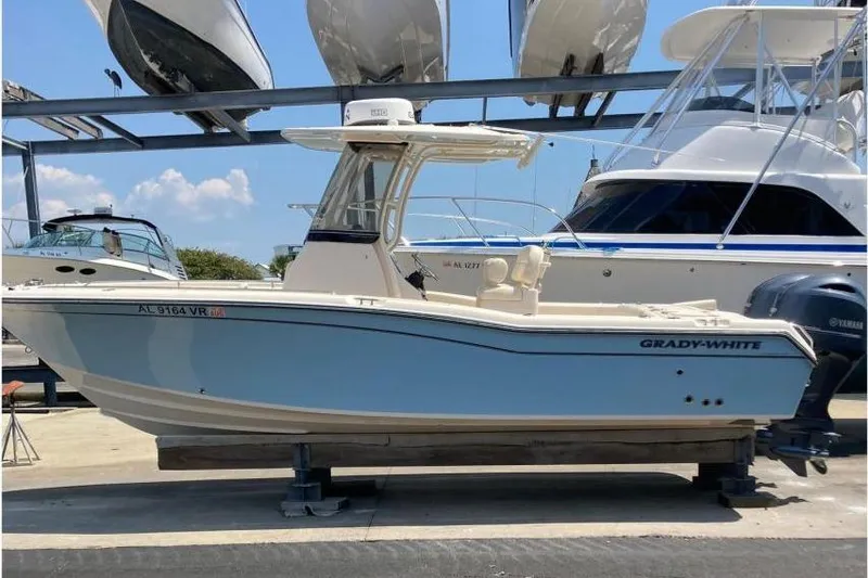 The Image of 2023 Grady-White Fisherman 257 boat displayed in a marina with other vessels. - 1