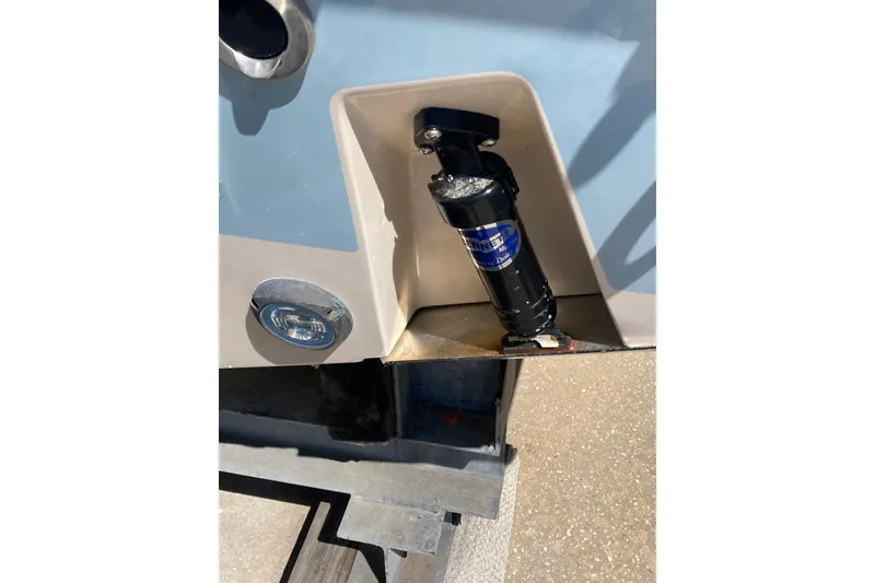 Slide: The Image of 2023 Grady-White Fisherman 257 boat detail showing trim tab and underwater light. - 12
