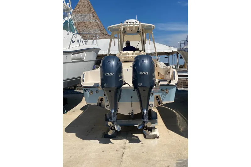 Slide: The Image of 2023 Grady-White Fisherman 257 boat with dual 200 horsepower engines, docked outdoors. - 5