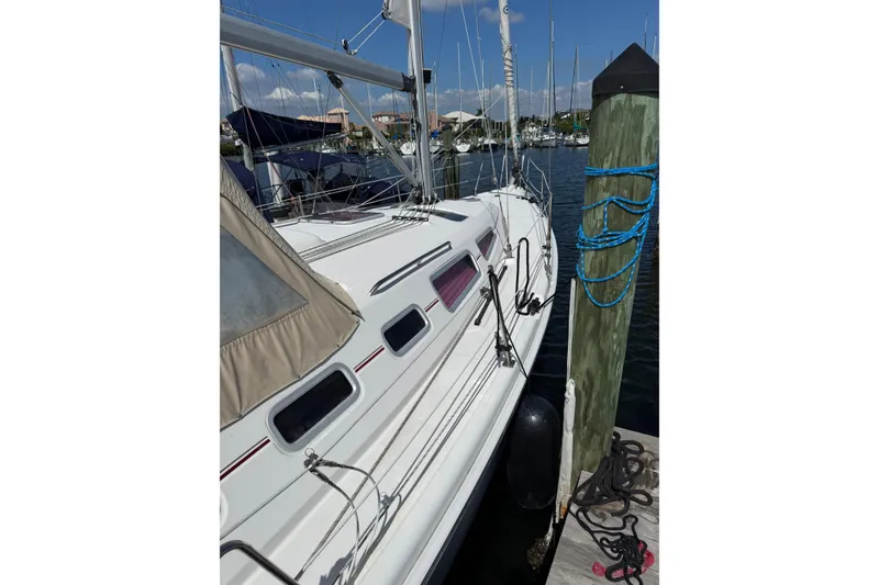 Slide: The Image of Sailboat docked at marina, Hunter 38 model, 2005, with clear skies. - 12