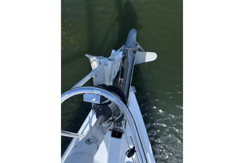 Slide: The Image of Bow view of 2005 Hunter 38 sailboat with anchor over water. - 20