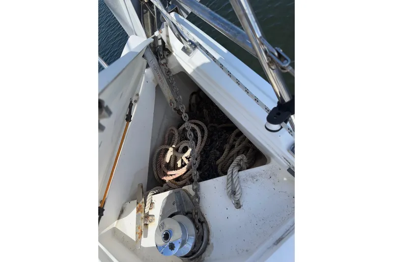 Slide: The Image of Anchor locker of a 2005 Hunter 38 sailboat with ropes and chains. - 21