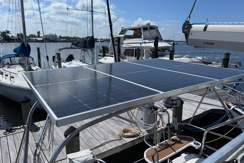 Slide: The Image of Hunter 38 sailboat with solar panels docked at marina, 2005 model. - 23