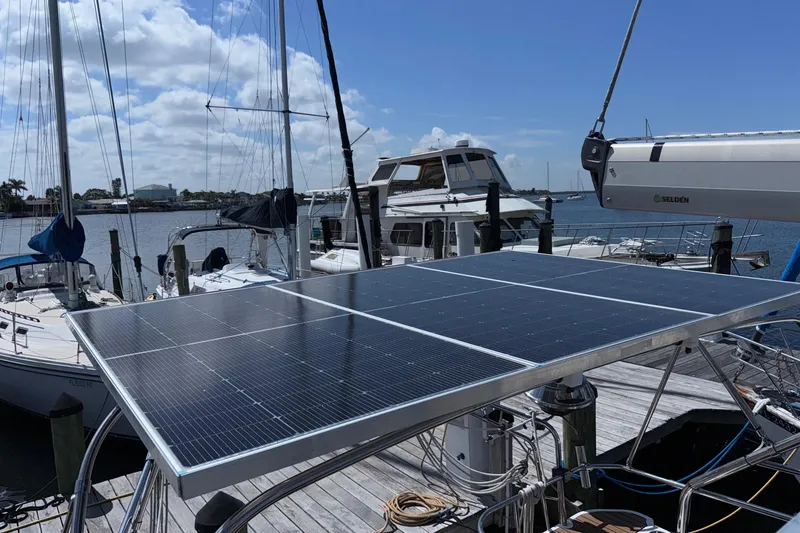 Slide: The Image of Hunter 38 sailboat with solar panels docked at marina, 2005 model. - 24