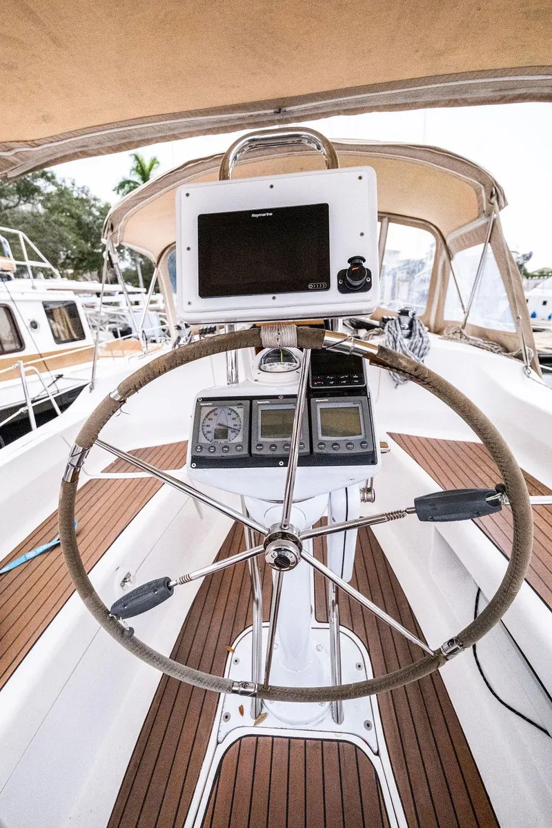 Slide: The Image of Steering wheel and navigation equipment on a 2005 Hunter 38 sailboat. - 26